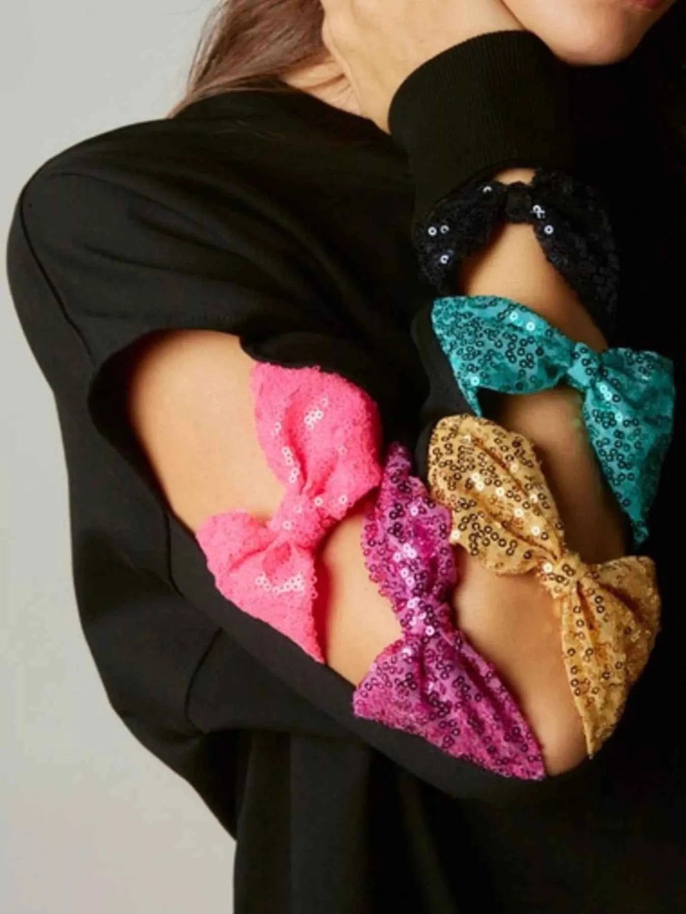 Sequin Bow Cutout Round Neck Sweatshirt